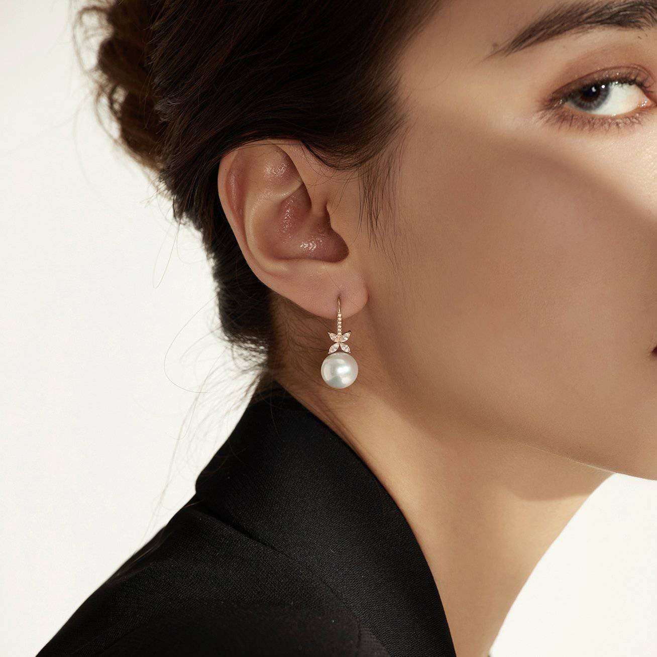 White Pearl Earrings on ear