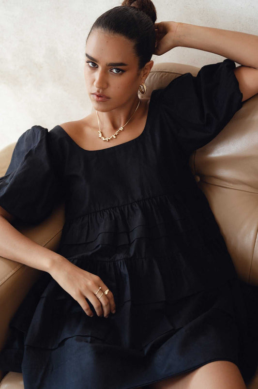 Andrea Babydoll Cotton Mini Dress with elasticated sleeves and round neckline.